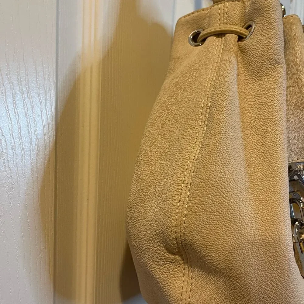 Michael Michael Kors leather beige drawstring bucket satchel.silver tone accents